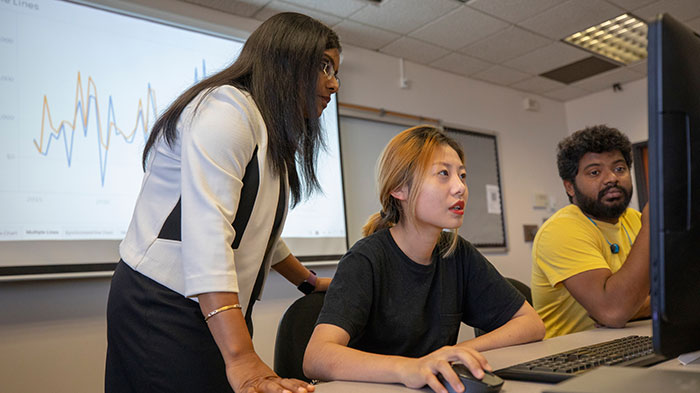 Instructor helping student read data