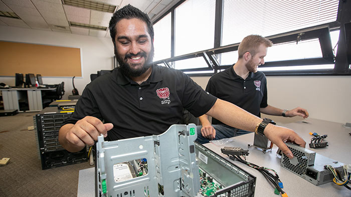 Students working on computer hardware